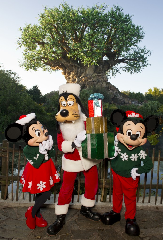 Mickey Minnie and Goofy dressed for the holidays